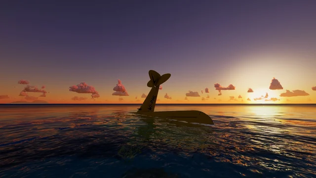 The tail of the plane sticking out of the sea at sunset